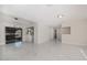 Open living room with marble floors, modern lighting, and sliding glass door with backyard view at 2167 Corfell St, Port Charlotte, FL 33948