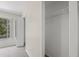 A well-lit walk-in closet with a single wire shelf offers practical storage space at 2306 Lake Woodberry Cir, Brandon, FL 33511