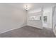 Bright dining area with adjacent kitchen and access to the back patio at 2306 Lake Woodberry Cir, Brandon, FL 33511