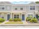 Charming townhouse with landscaped front yard featuring desert plants and grey exterior paint at 2306 Lake Woodberry Cir, Brandon, FL 33511
