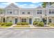 Charming townhouse featuring landscaped yards and grey exterior paint at 2306 Lake Woodberry Cir, Brandon, FL 33511