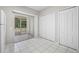 Bright kitchen with tile flooring, sliding glass door to patio, and convenient closet space at 2306 Lake Woodberry Cir, Brandon, FL 33511