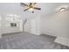 Bright living room featuring carpet, ceiling fan and staircase at 2306 Lake Woodberry Cir, Brandon, FL 33511