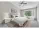 This spacious main bedroom is bright and features neutral colors and ample natural light at 2306 Lake Woodberry Cir, Brandon, FL 33511