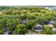 Aerial view showcasing the community nestled among mature trees with well-maintained lawns and landscaping at 2373 Hounds Trl, Palm Harbor, FL 34683