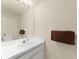 Neutral bathroom featuring a white vanity, a sink, and a large mirror at 2373 Hounds Trl, Palm Harbor, FL 34683