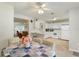 Open-concept dining and kitchen area, great for entertaining with lots of light and neutral colors at 2373 Hounds Trl, Palm Harbor, FL 34683