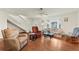 Bright living room with staircase, ceiling fan and large windows at 2373 Hounds Trl, Palm Harbor, FL 34683