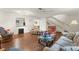 Cozy living room with stairs, comfortable furnishings, and warm ambiance at 2373 Hounds Trl, Palm Harbor, FL 34683