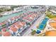 Aerial view of waterfront condos, tennis courts, and baseball fields in the community at 250 Medallion Blvd # H, Madeira Beach, FL 33708