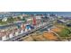 An elevated view of a row of townhomes with harbor access on a sunny day, near athletic fields at 250 Medallion Blvd # H, Madeira Beach, FL 33708