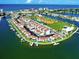 Stunning aerial view of waterfront condos, a marina, and recreational amenities at 250 Medallion Blvd # H, Madeira Beach, FL 33708