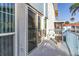 Balcony with patio furniture, blue railings, and views of nearby building at 250 Medallion Blvd # H, Madeira Beach, FL 33708