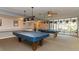 Bright community billiards room with pool tables and ample seating at 250 Medallion Blvd # H, Madeira Beach, FL 33708