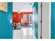 Hallway view leading to a bright and stylish living room with modern decor at 250 Medallion Blvd # H, Madeira Beach, FL 33708