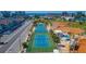 Aerial view of multiple community tennis courts offering residents recreational opportunities at 250 Medallion Blvd # H, Madeira Beach, FL 33708