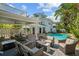 Inviting backyard featuring a pool, patio area, and lush landscaping at 2523 W Sunset Dr, Tampa, FL 33629