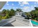 Beautiful two-story house from the top of the deck surrounded by lush landscaping and a pool at 2523 W Sunset Dr, Tampa, FL 33629