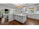 Spacious kitchen with a large island, white cabinets, and high-end appliances at 2523 W Sunset Dr, Tampa, FL 33629