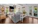 Inviting living room with hardwood floors, large windows, and comfortable seating at 2523 W Sunset Dr, Tampa, FL 33629