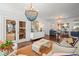 Sophisticated living room showcasing a stylish chandelier and decor near wine cellar at 2523 W Sunset Dr, Tampa, FL 33629