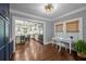 Bright office space leading to the adjacent kitchen with stainless steel appliances at 2523 W Sunset Dr, Tampa, FL 33629