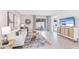 Inviting living room with stylish decor and a sliding glass door that provides natural light at 2585 Birney Run, Zephyrhills, FL 33541