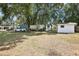 Expansive backyard with utility shed, carport, and ample green space at 2604 Oakdale St, Seffner, FL 33584
