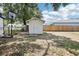 Backyard showcasing a utility shed and a basketball hoop, great for storage at 2604 Oakdale St, Seffner, FL 33584