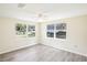 A bright bedroom with wood-like floors, large windows, and plenty of natural light at 2604 Oakdale St, Seffner, FL 33584