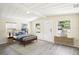 A well-lit bedroom featuring a cozy bed, stylish furniture, and windows providing natural light at 2604 Oakdale St, Seffner, FL 33584