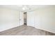A clean and spacious bedroom with modern floors, natural light, and a closet at 2604 Oakdale St, Seffner, FL 33584