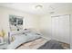 A beautifully staged bedroom with a comfortable bed, stylish decor, and bright natural light at 2604 Oakdale St, Seffner, FL 33584