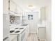 Functional kitchen with white appliances and light-colored backsplash at 2604 Oakdale St, Seffner, FL 33584