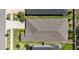 An aerial roof-top view of a home showcasing well-manicured landscaping at 2644 Leafwing Ct, Palm Harbor, FL 34683