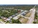 An aerial view of a planned community with a red marker indicating a specific home at 2644 Leafwing Ct, Palm Harbor, FL 34683