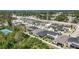 An aerial view of a neighborhood featuring sidewalks and lush landscaping at 2644 Leafwing Ct, Palm Harbor, FL 34683