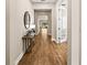 Inviting foyer featuring wood floors and an elegant entry to the home at 2644 Leafwing Ct, Palm Harbor, FL 34683