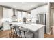 Modern kitchen with stainless appliances, a large island, and lots of cabinets at 2644 Leafwing Ct, Palm Harbor, FL 34683