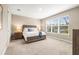 Spacious bedroom filled with natural light, featuring a large window and tasteful decor at 2644 Leafwing Ct, Palm Harbor, FL 34683