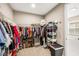 Well-organized walk-in closet with ample hanging space and shelving, offering generous storage solutions at 2644 Leafwing Ct, Palm Harbor, FL 34683