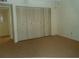 Neutral bedroom with ample closet space offering plenty of storage, ready for personal touches at 2737 Enterprise E Rd # 122, Clearwater, FL 33759