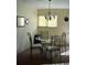 Cozy dining area with a glass table and elegant wrought iron chairs, perfect for intimate meals at 2737 Enterprise E Rd # 122, Clearwater, FL 33759