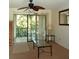 Bright living room with sliding glass doors leading to a balcony with outdoor view, enhancing natural light at 2737 Enterprise E Rd # 122, Clearwater, FL 33759