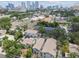 Scenic aerial view of homes surrounded by lush greenery, showcasing the vibrant cityscape in the background at 310 S Delaware Ave # F, Tampa, FL 33606