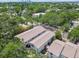 Aerial view of townhouses with well-maintained exteriors, back patios, and lush landscaping at 310 S Delaware Ave # F, Tampa, FL 33606