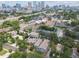 City view from above homes with green trees, with Tampa cityscape in background, highlighting the urban setting at 310 S Delaware Ave # F, Tampa, FL 33606