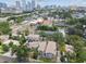 Scenic aerial view of homes surrounded by lush greenery, showcasing the vibrant cityscape in the background at 310 S Delaware Ave # F, Tampa, FL 33606