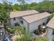 Aerial view of townhouses with well-maintained exteriors, back patios, and lush landscaping at 310 S Delaware Ave # F, Tampa, FL 33606