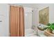 Bright bathroom featuring a shower/tub combo and earthy accents at 310 S Delaware Ave # F, Tampa, FL 33606